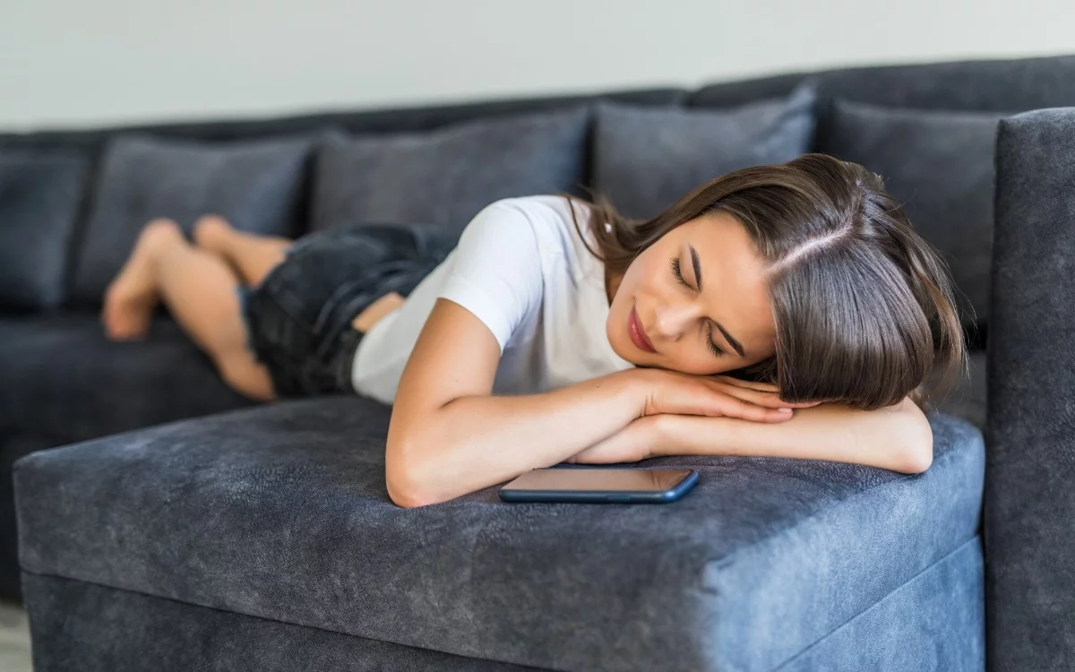 Why is sleeping on the couch so irresistible? Experts reveal the reasons behind this common habit.